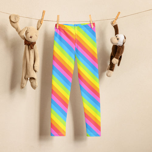 Girls bright rainbow diagonal striped buttery soft leggings brightly striped hanging on a clothesline