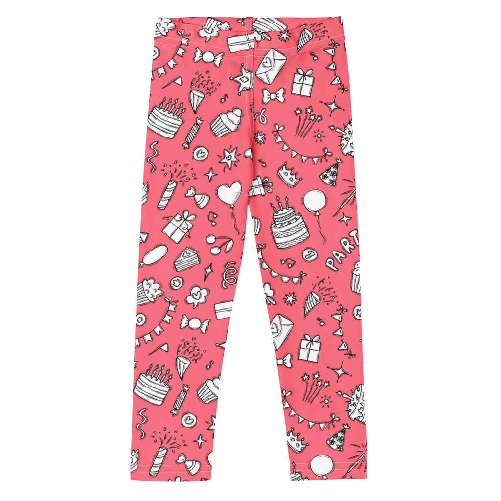 Girls pink buttery soft leggings with playful party-themed black and white cakes balloons gifts and confetti pattern