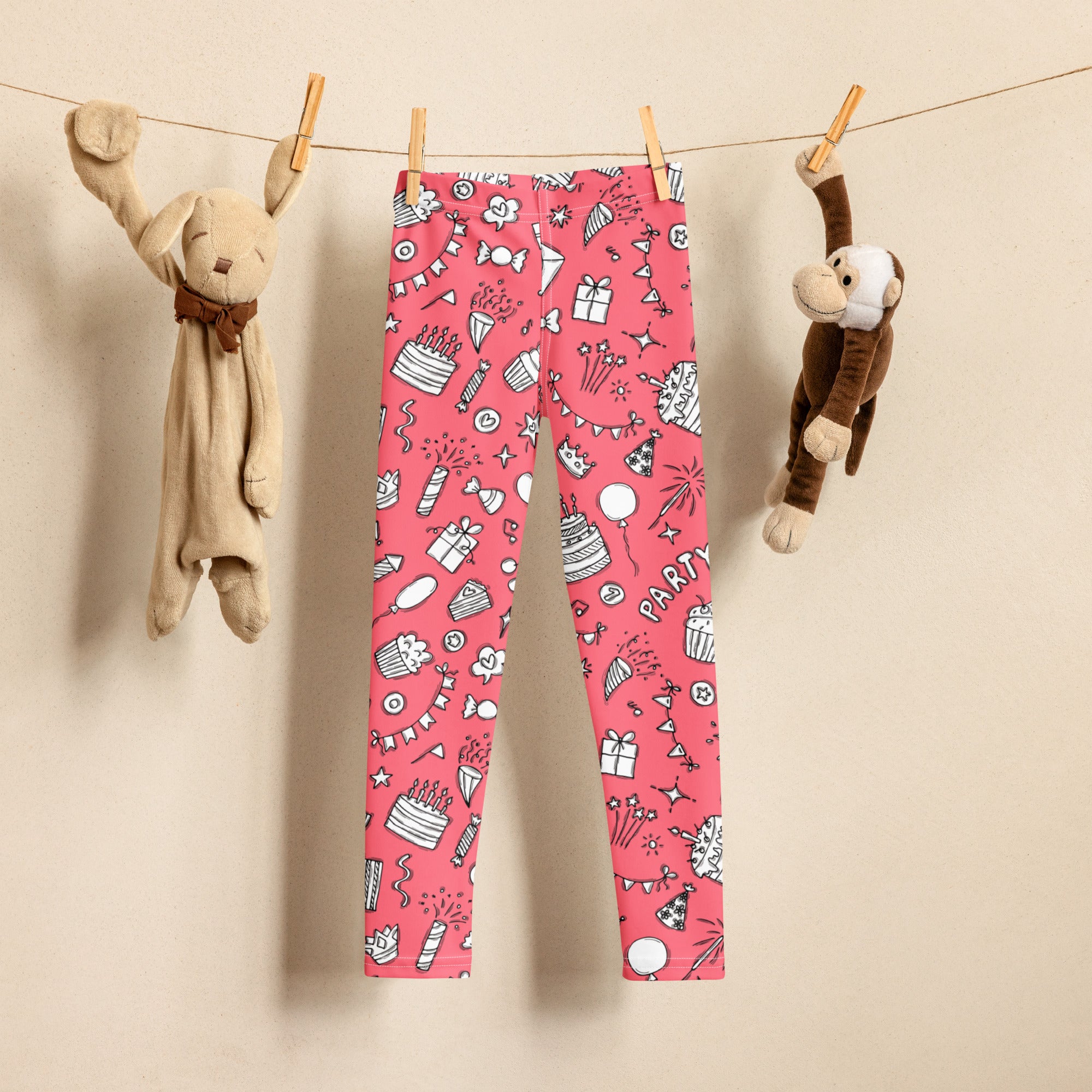 Girls pink birthday party buttery soft leggings with playful cakes balloons and confetti pattern in white and black outlines