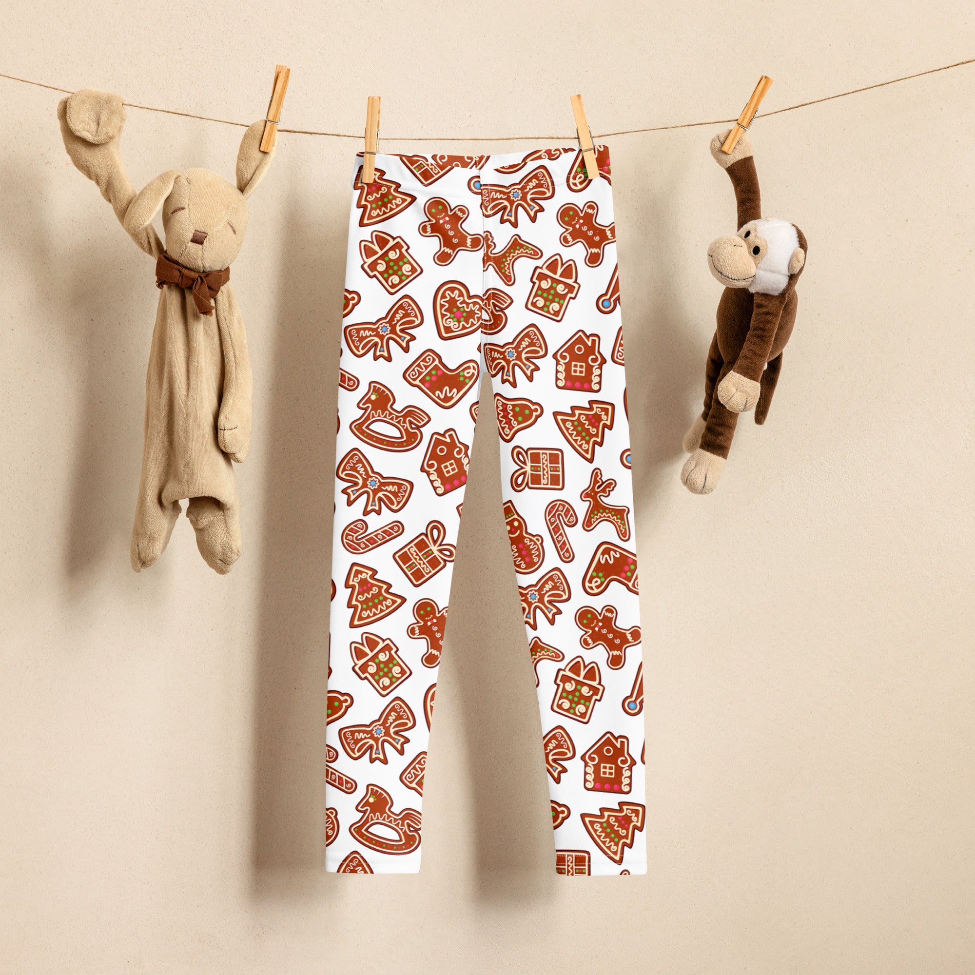 Kids gingerbread cookie christmas buttery soft white leggings with festive brown and red cookie and bow patterns