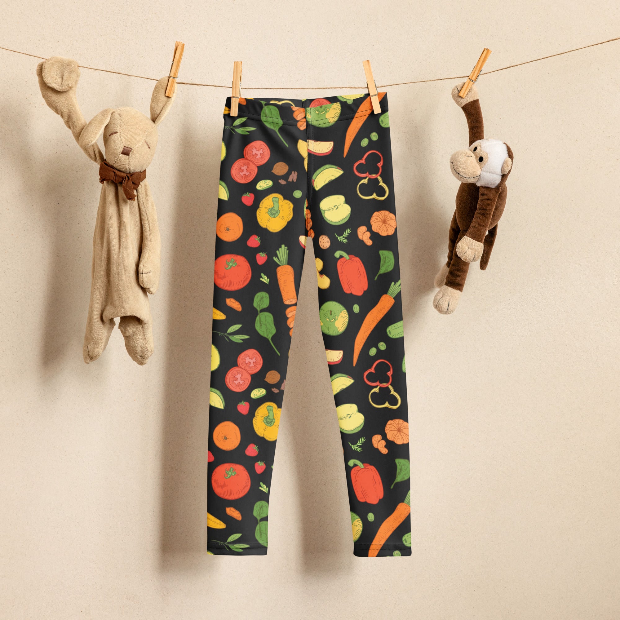 Kids veggie print buttery soft leggings in black with vibrant colorful fruits and vegetables print