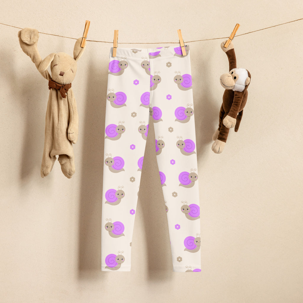 Girls purple snail buttery soft white leggings with playful purple and gray snail pattern hanging on clothesline