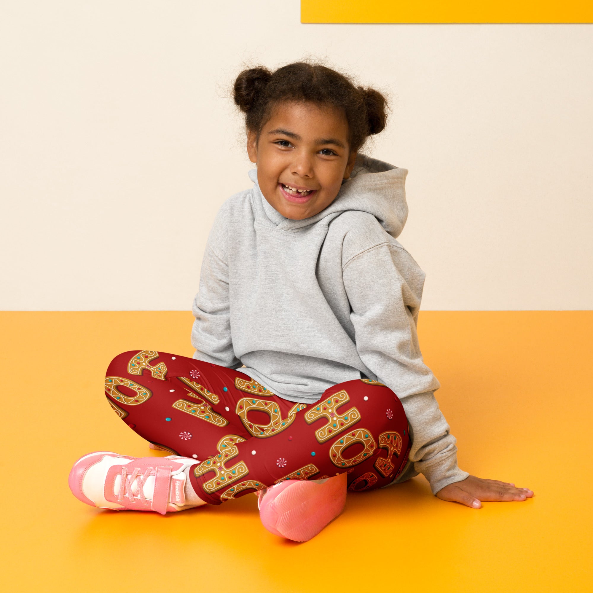Girls gingerbread ho ho ho christmas buttery soft red leggings with gold and blue lettering design