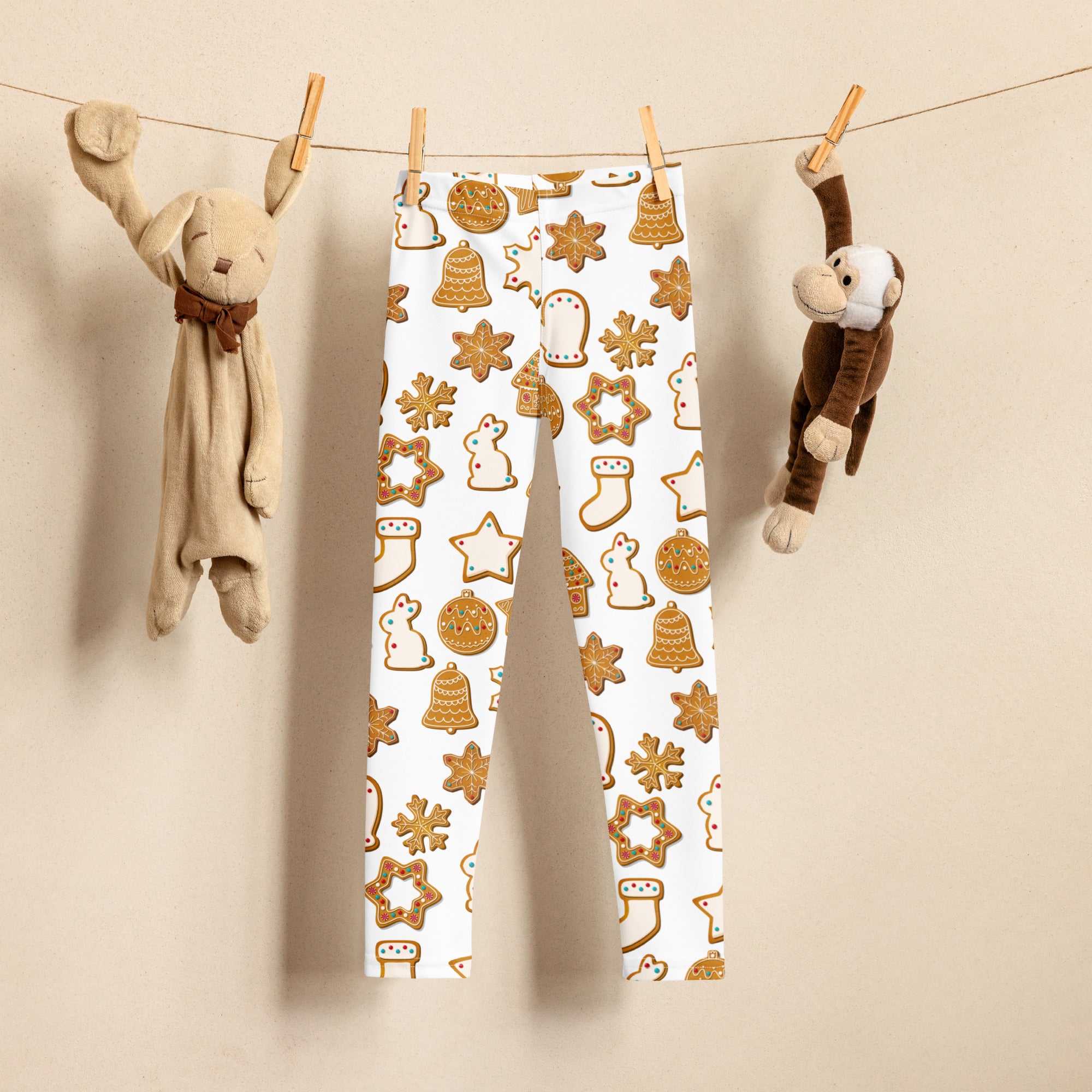 White kids leggings with a golden brown gingerbread cookie festive pattern made from buttery soft fabric for christmas