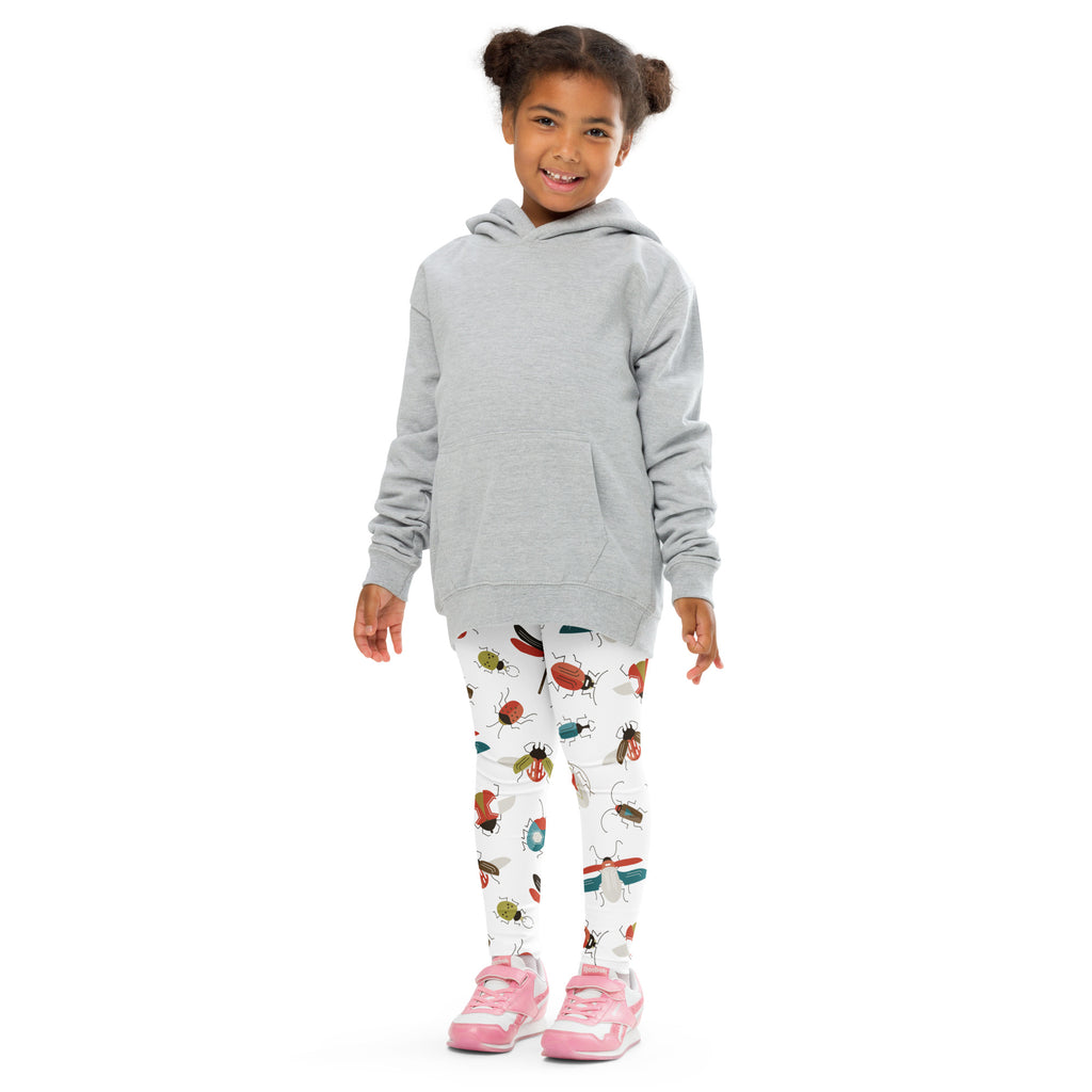 Child wearing a gray hooded sweatshirt with long sleeves and front pocket paired with kids bug print buttery soft leggings