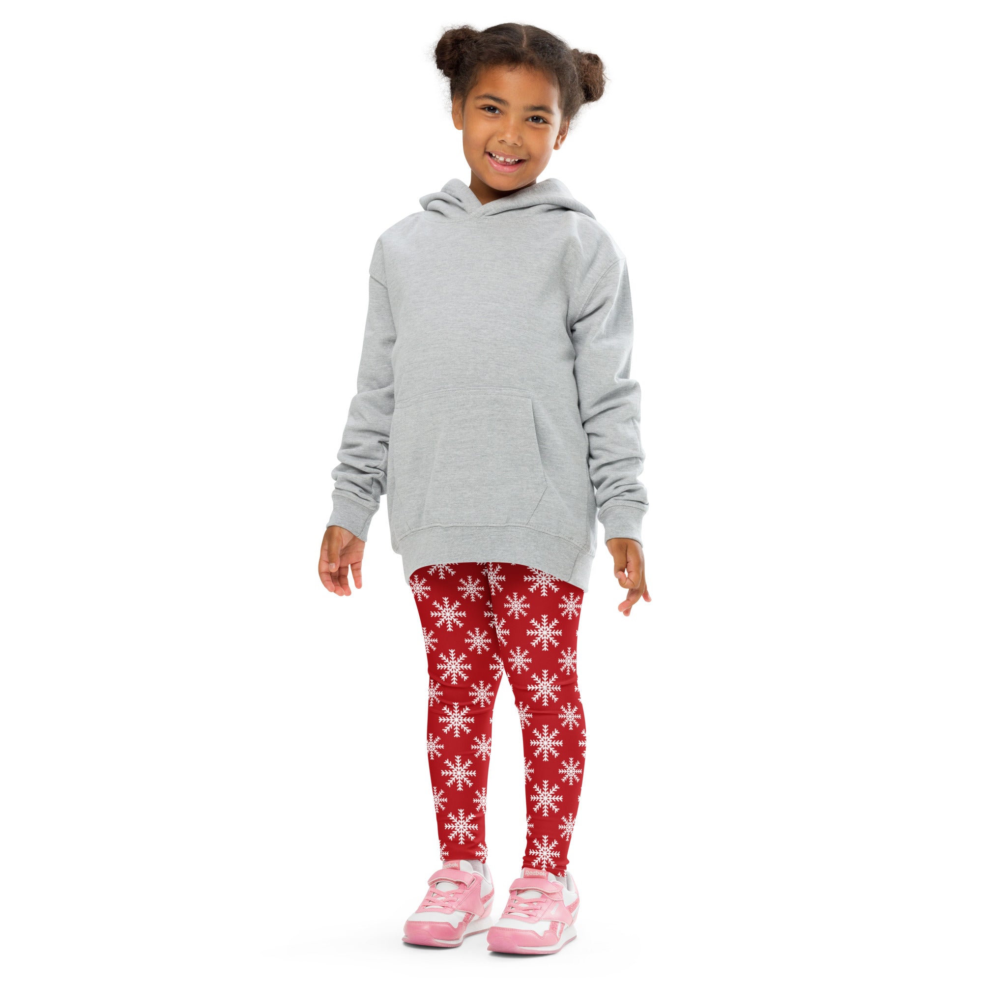 Kids red snowflake christmas buttery soft leggings paired with a gray hooded sweatshirt with front pocket and long sleeves