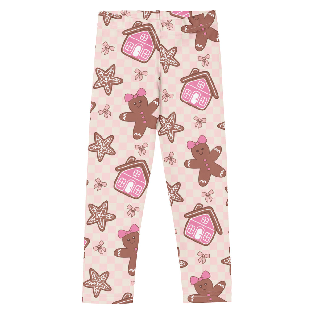 Girls pink buttery soft leggings with gingerbread men bows pink houses star cookies on light pink checkered background