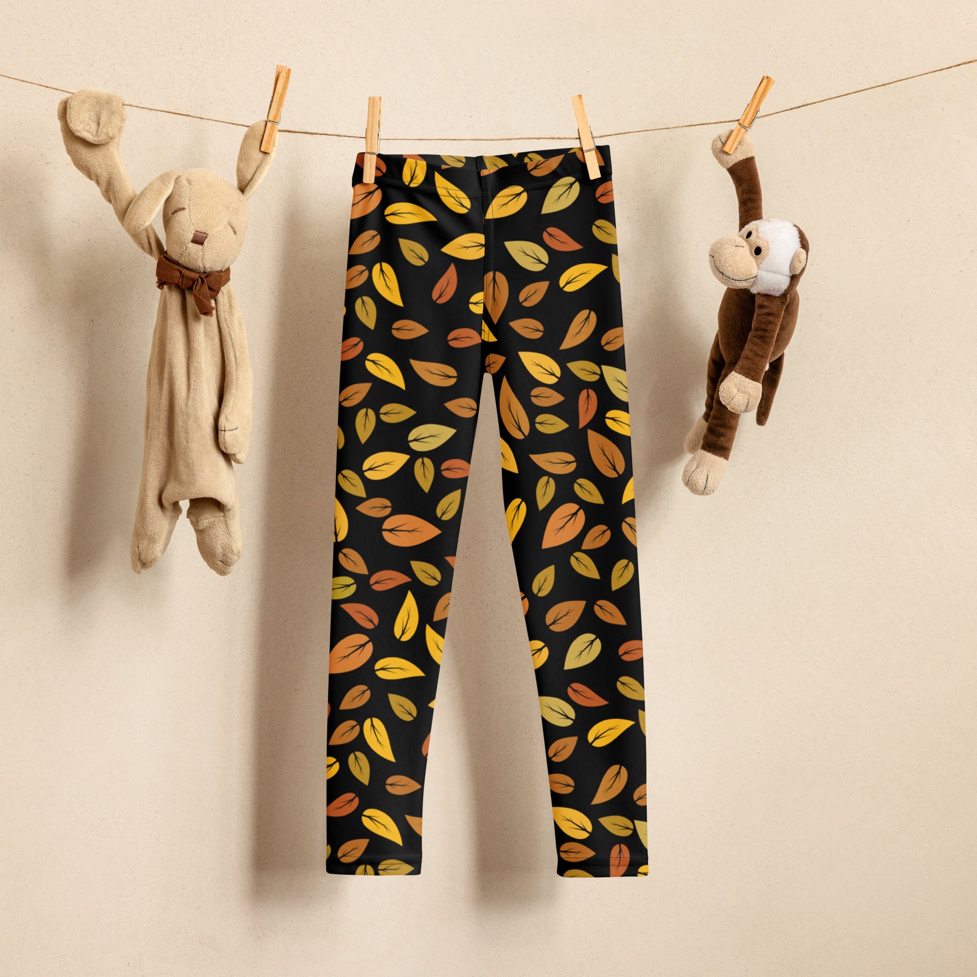 Kids autumn leaf buttery soft black leggings with vibrant yellow orange and brown autumn leaf pattern