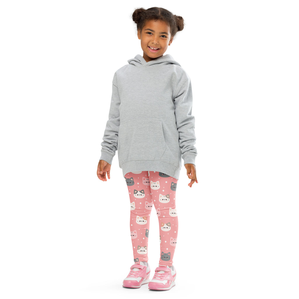 A child wearing girls cute pink cat faces buttery soft leggings with a light gray hooded sweatshirt