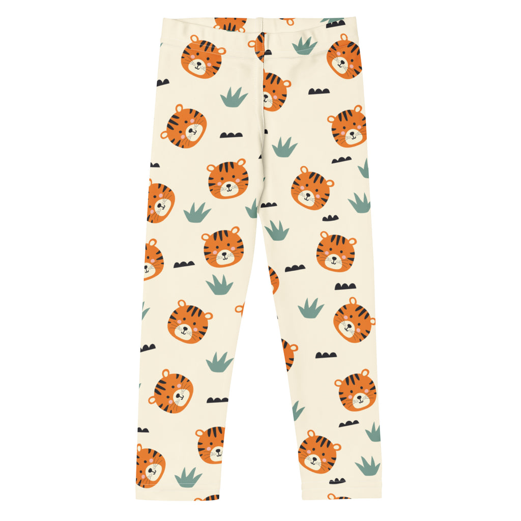 Cream-colored kids tiger print buttery soft leggings with orange tiger faces and green cactus pattern