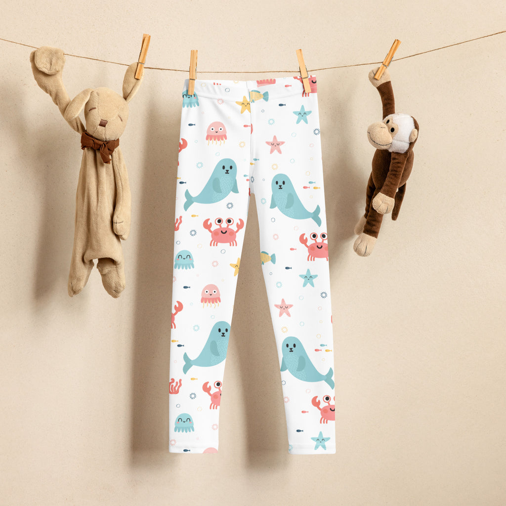 Girls ocean animal buttery soft white leggings with playful blue seals pink crabs and starfish pattern