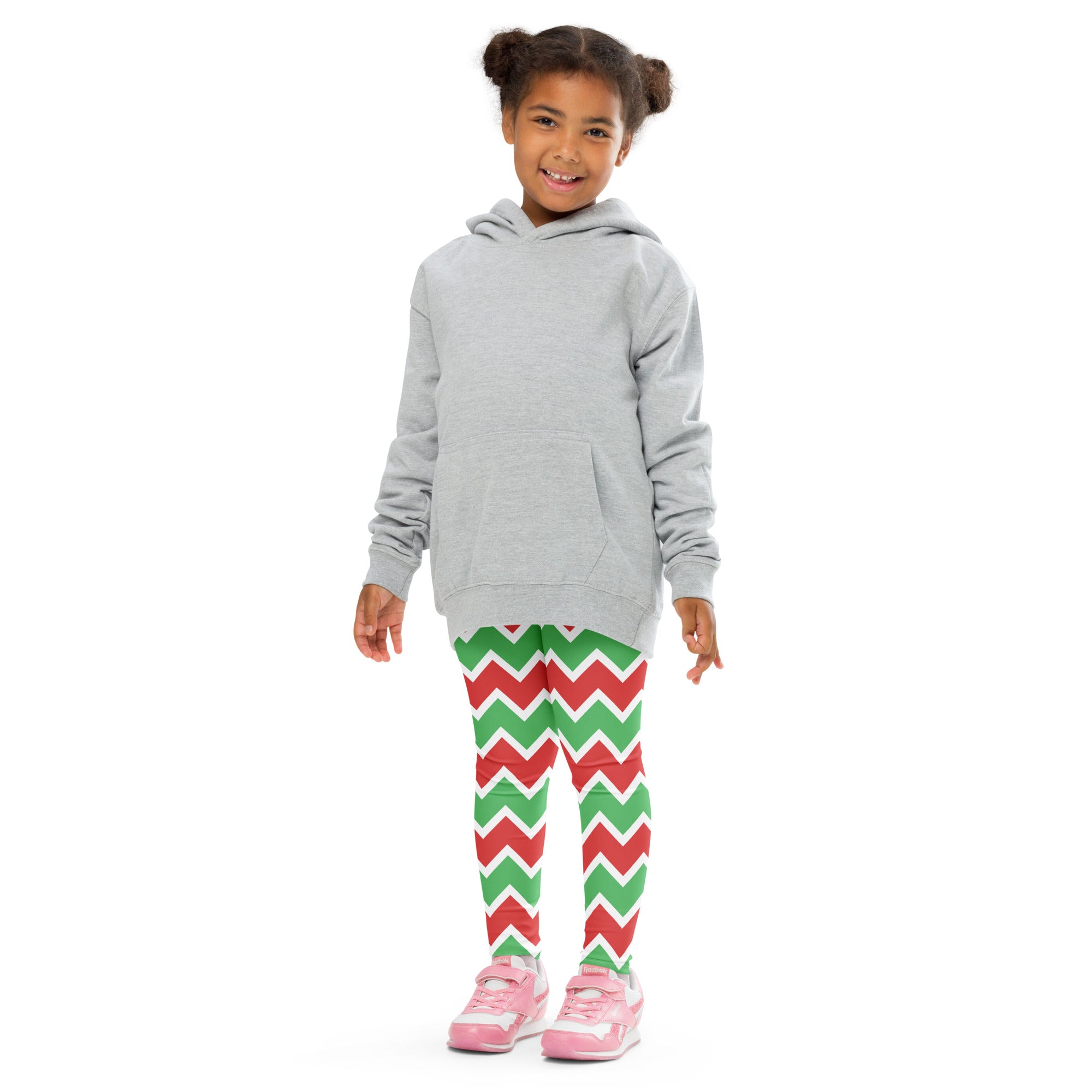 Child wearing a gray long sleeve hooded sweatshirt with front pocket paired with kids christmas chevron striped leggings