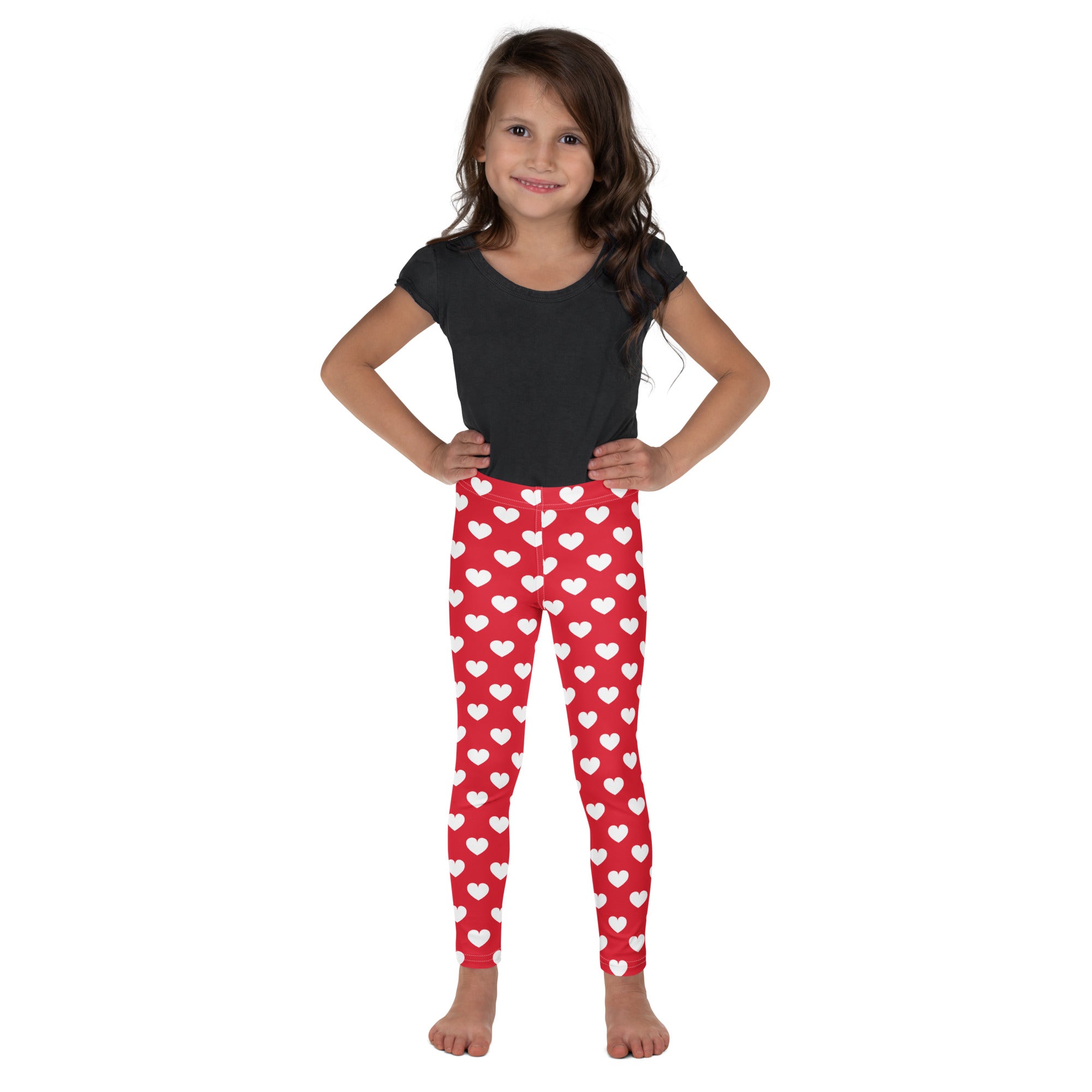 Girls red heart buttery soft leggings featuring a white heart pattern and a comfortable stretchy fabric design