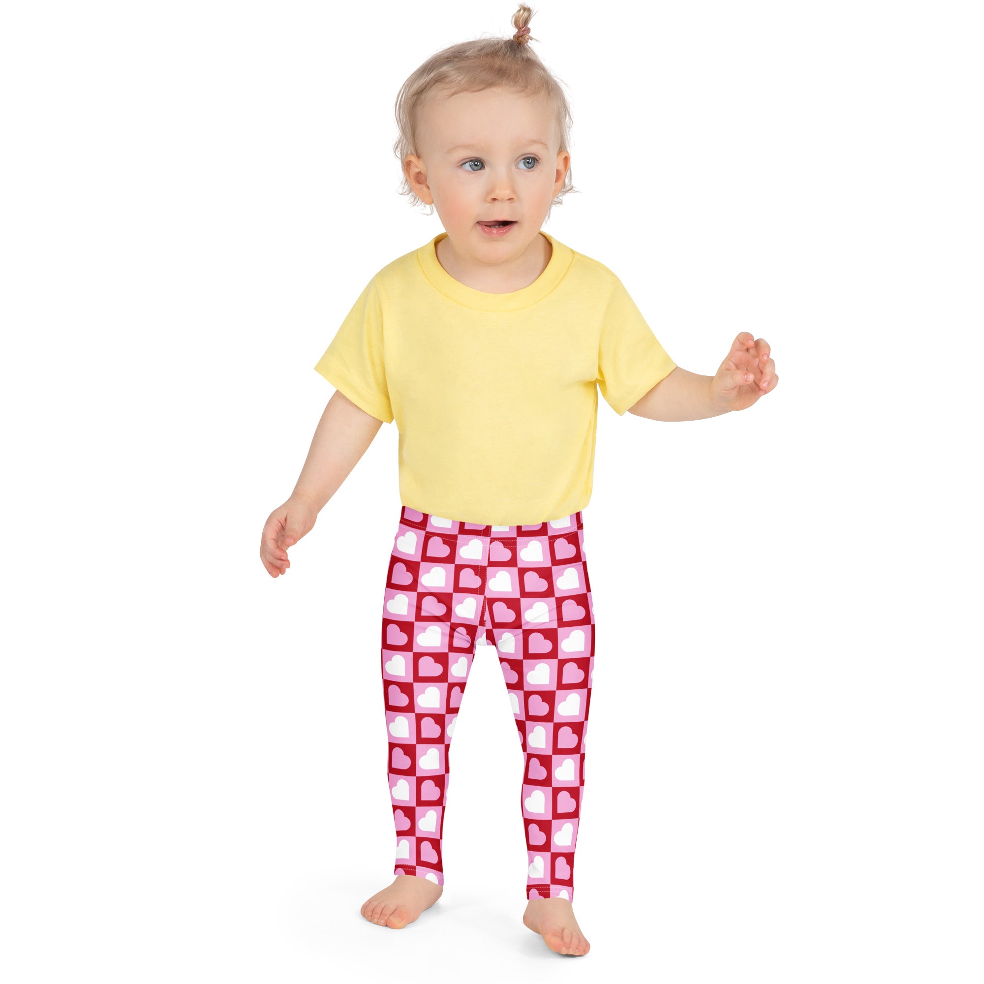 Girls pink checkered heart buttery soft leggings featuring a pink and white heart pattern with a grid design