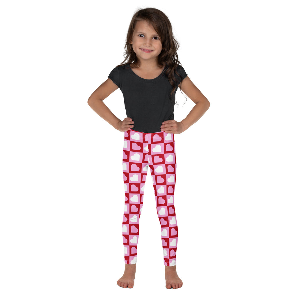 Girls pink checkered heart buttery soft leggings featuring pink and white heart patterns with a grid design