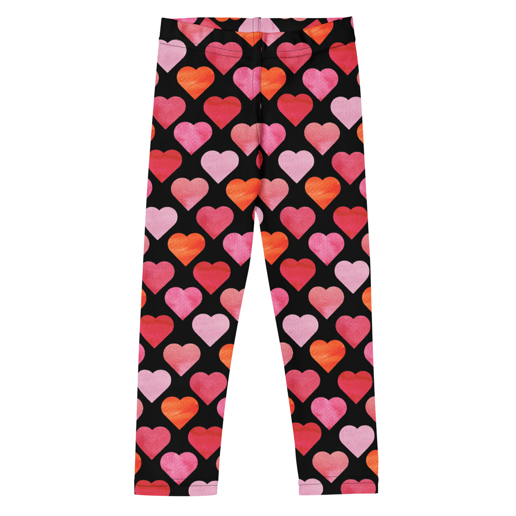 Girls black heart buttery soft leggings with vibrant pink coral and orange watercolor-style heart pattern