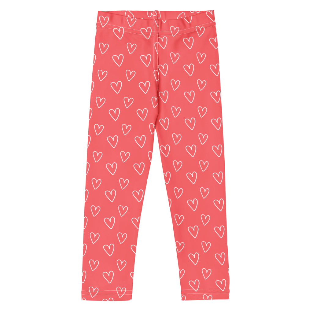 Girls pink heart outline buttery soft leggings in coral pink with white heart pattern for comfortable wear