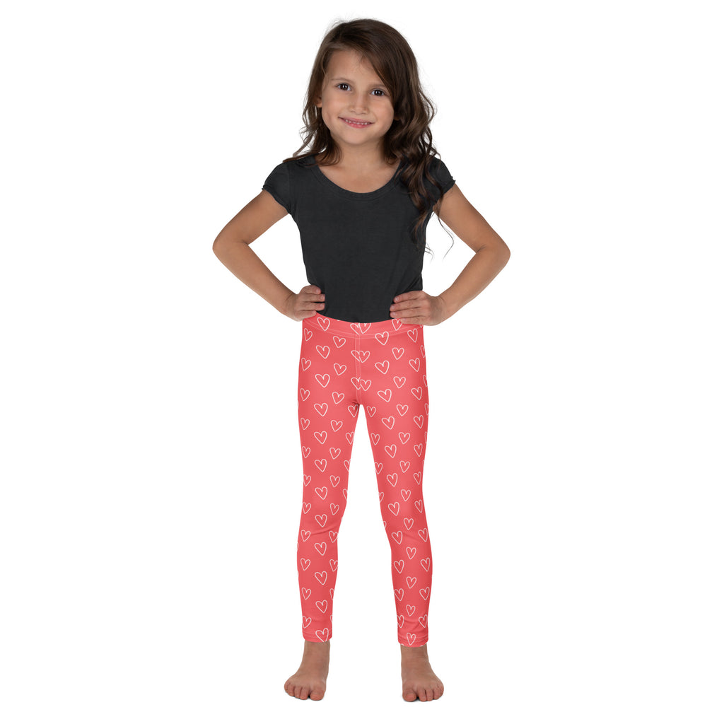 Girls pink heart outline buttery soft leggings featuring white heart patterns for comfortable everyday wear