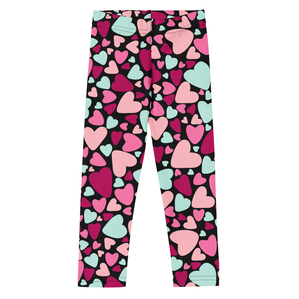 Girls multicolor heart buttery soft leggings featuring black fabric with vibrant pink and mint green heart patterns