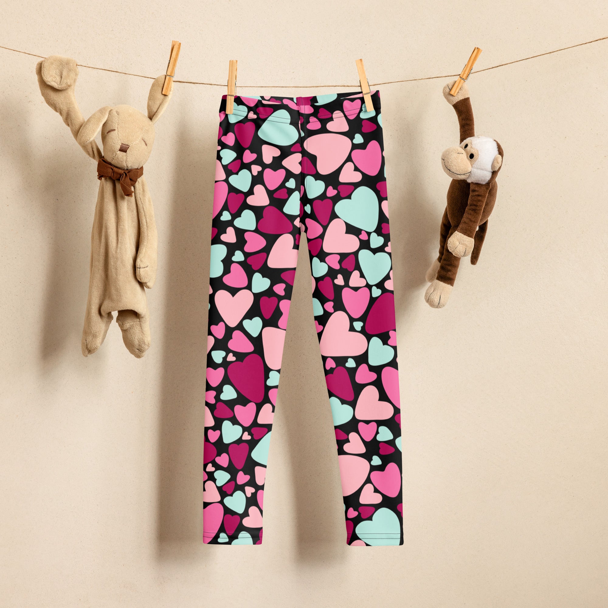 Girls multicolor heart buttery soft black leggings with vibrant pink magenta and mint green heart patterns