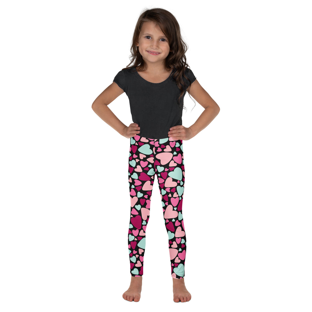 Girls multicolor heart buttery soft leggings in pink and mint green worn by a young girl