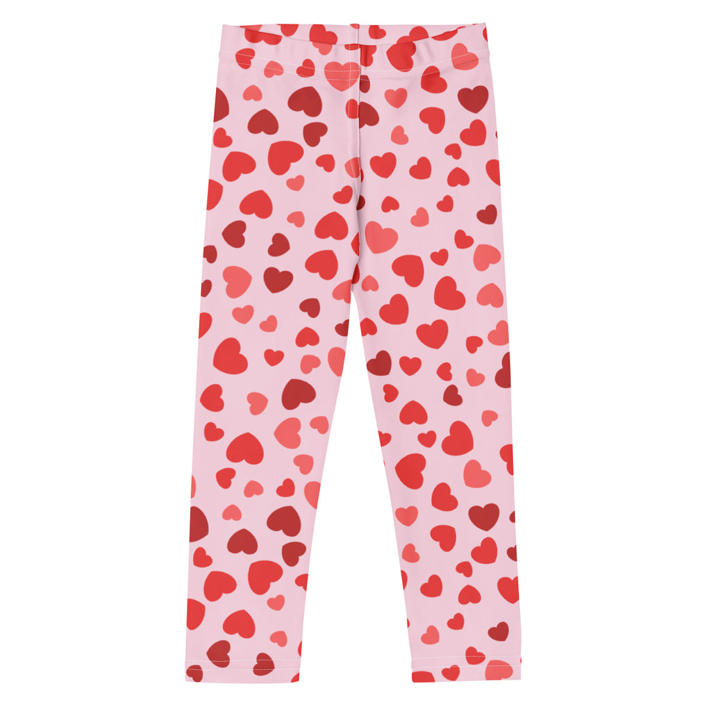Girls Valentine’s Day pink buttery soft leggings with playful red heart pattern for comfortable wear