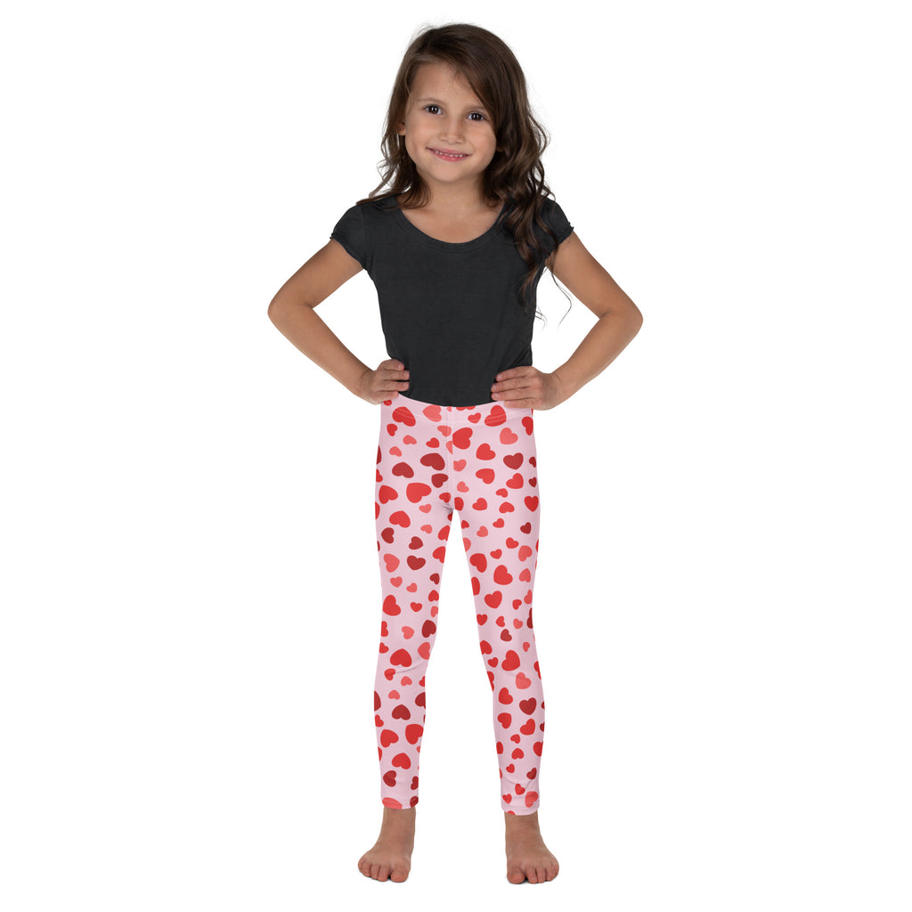 Pink leggings with a pattern of red hearts.