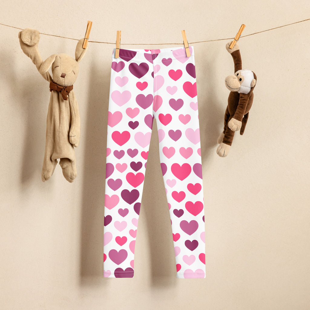 Girls purple and pink hearts buttery soft white leggings featuring a playful heart pattern for everyday wear