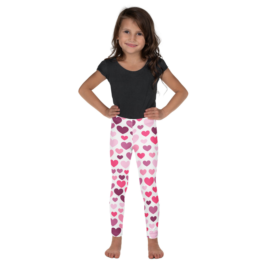 Girls purple and pink hearts buttery soft leggings worn by a young girl featuring heart pattern in purple and pink