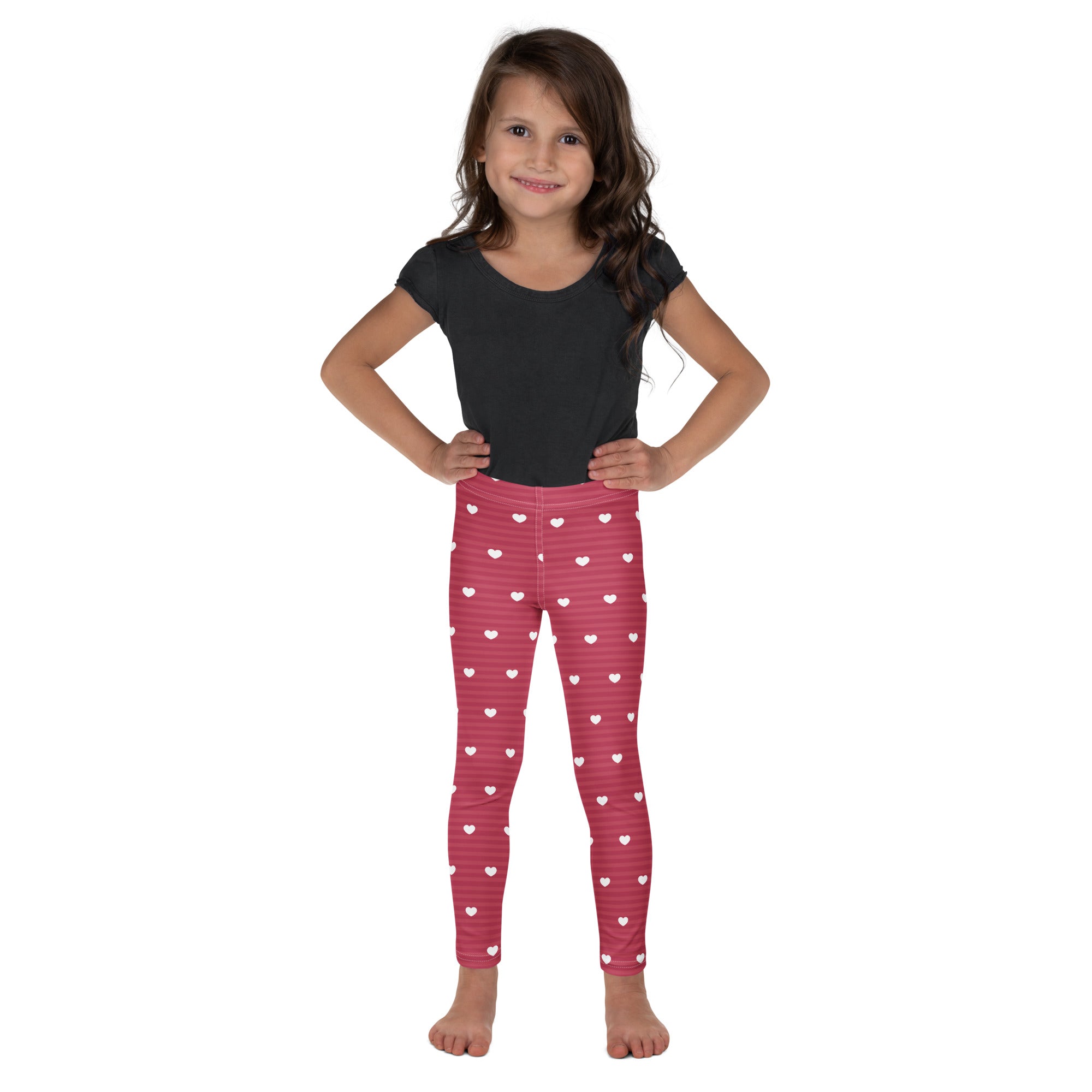 Girls pink stripe heart leggings featuring white heart patterns and subtle horizontal stripes in buttery soft fabric
