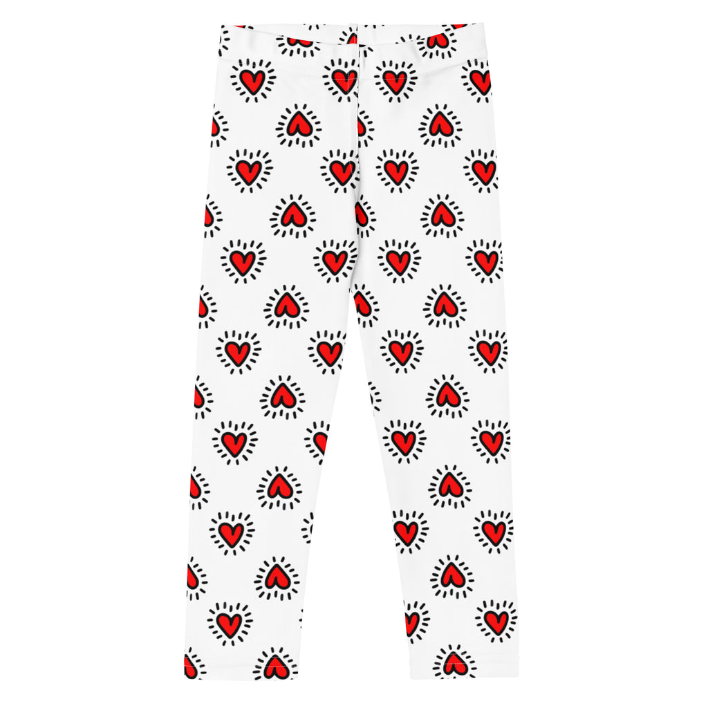Girls valentine’s day buttery soft white leggings with a repeating pattern of red hearts outlined in black with radiating lines