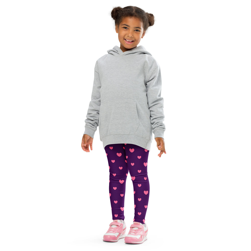 A child wearing girls purple heart leggings buttery soft purple leggings with pink hearts and pink sneakers