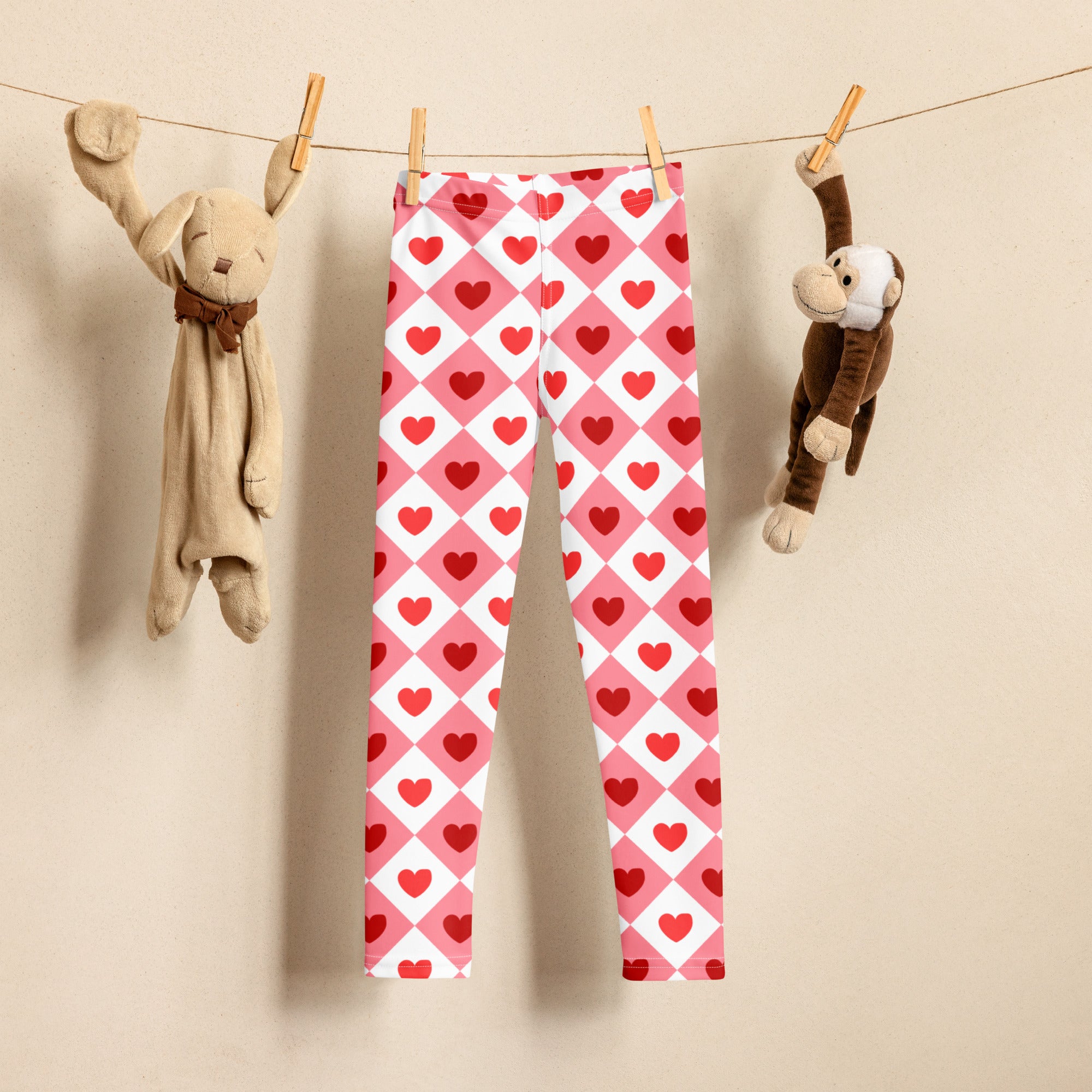 Girls pink argyle heart leggings buttery soft pink and white argyle with red hearts hanging on a clothesline