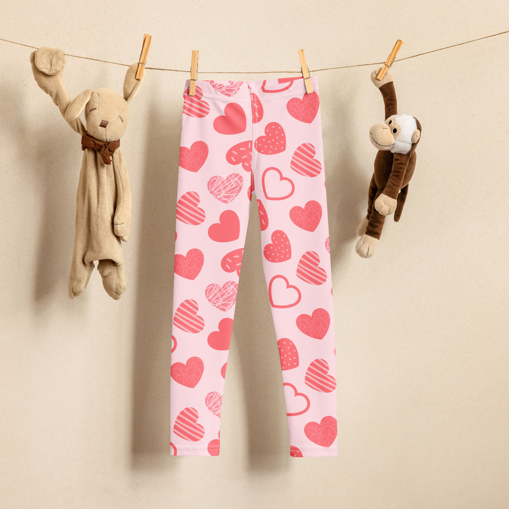 Girls pink heart pattern leggings featuring solid and striped red hearts on buttery soft stretchy fabric