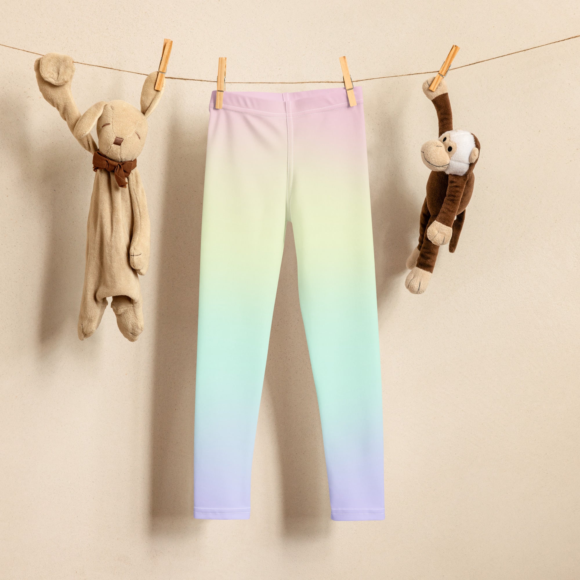 Girls pastel rainbow buttery soft leggings with smooth stretchy fabric in a lavender to mint green gradient
