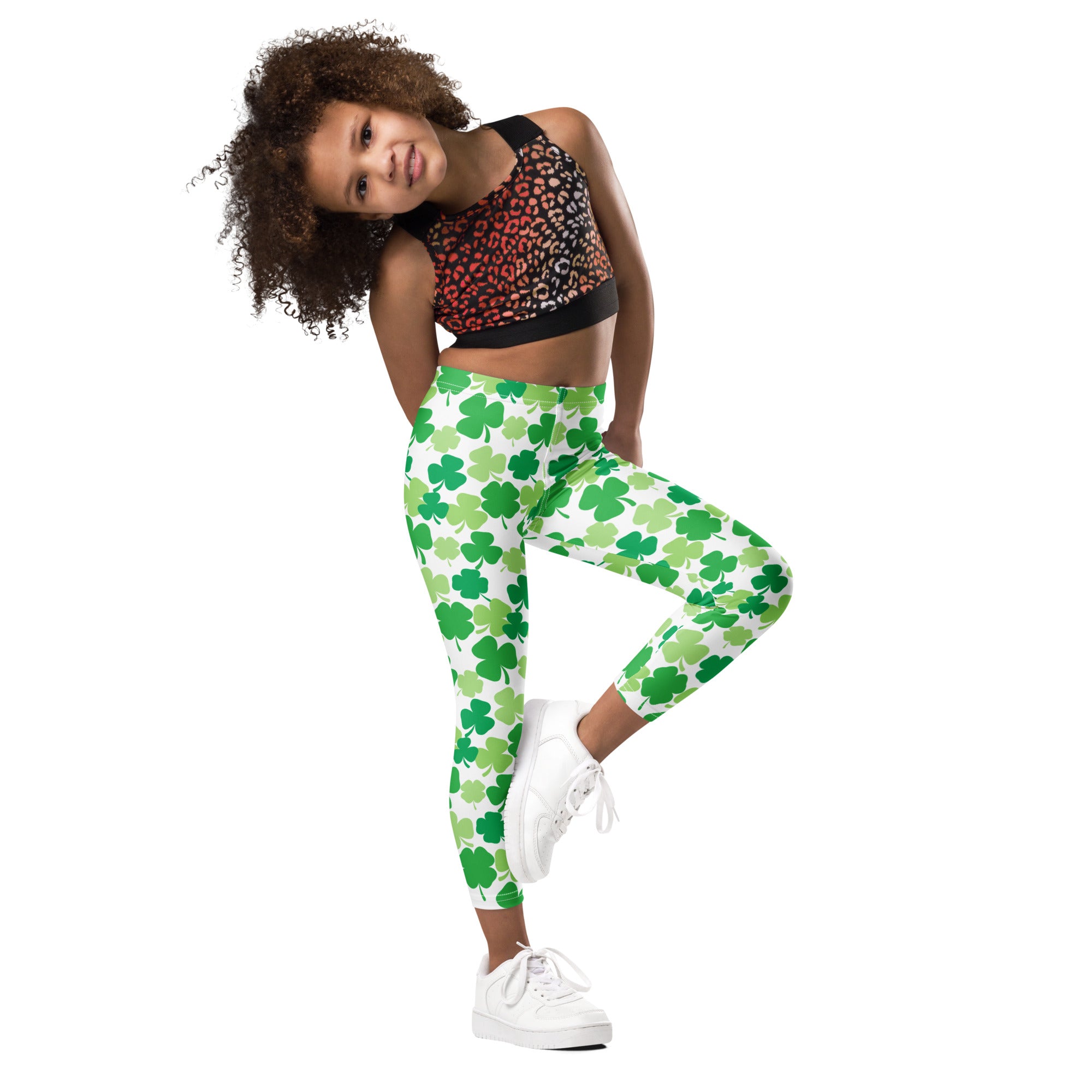 Girls green shamrock buttery soft leggings with white base featuring a soft comfortable fabric and festive pattern