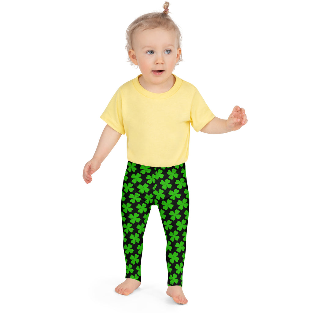 Girls black and green shamrock buttery soft leggings featuring bright green four leaf clover pattern
