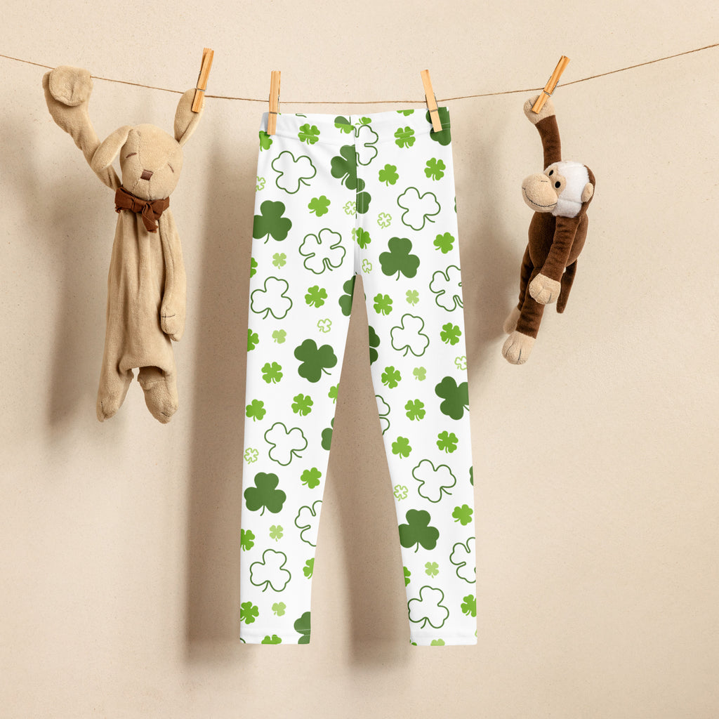 Girls white buttery soft leggings with playful green and white shamrock pattern perfect for festive wear