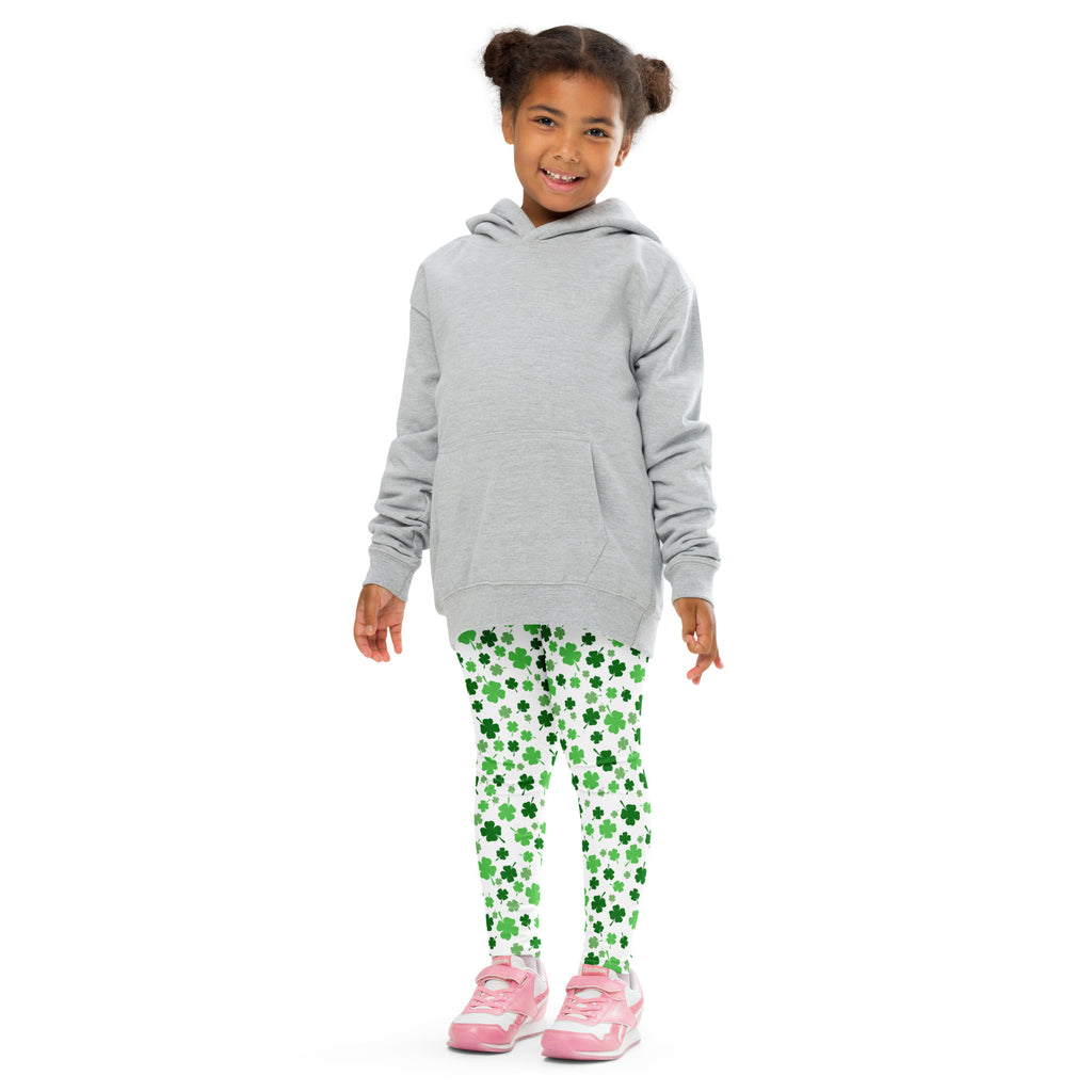 Gray hooded sweatshirt with front pocket and long sleeves worn over green shamrock print buttery soft leggings for girls