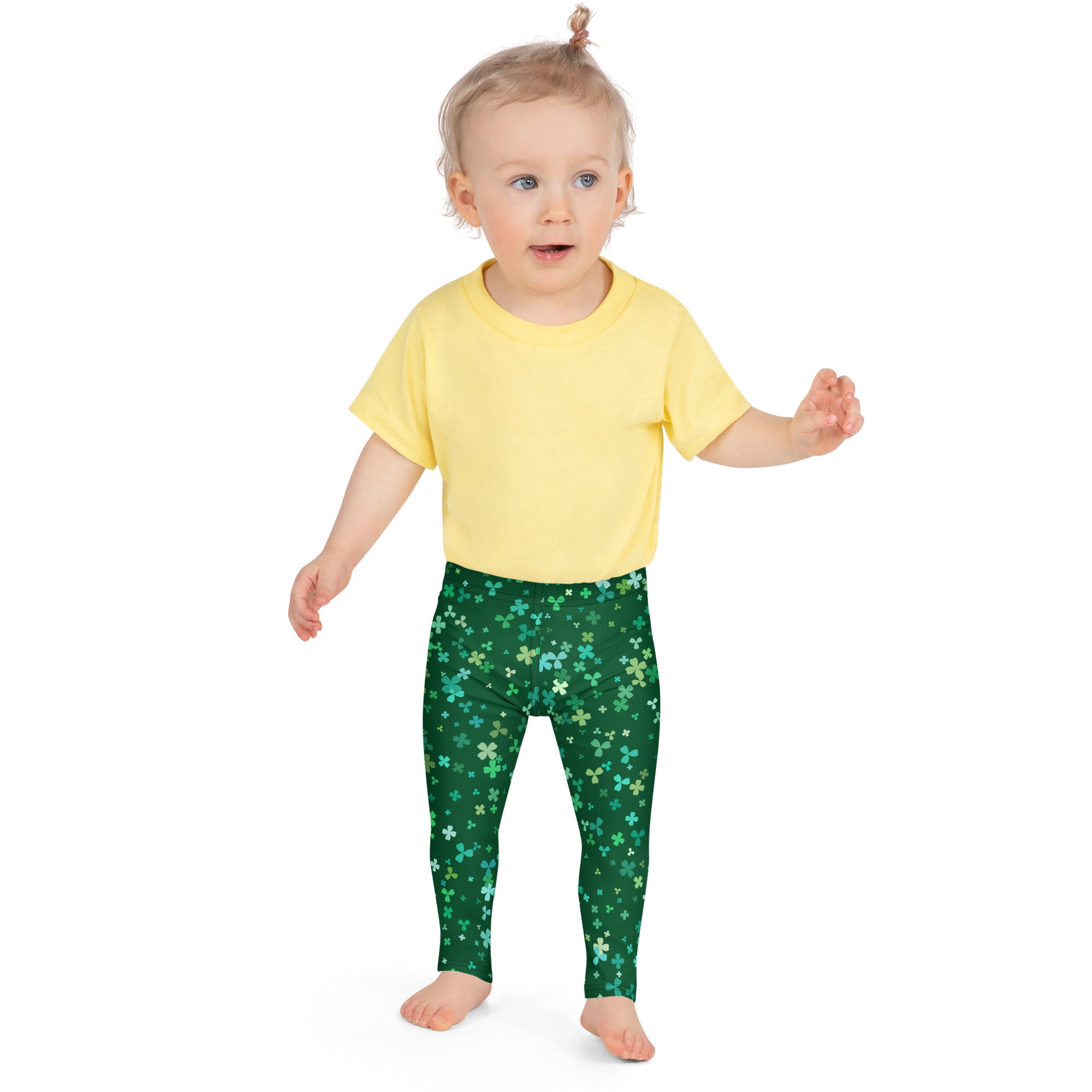 Girls teal and green shamrock buttery soft leggings with a pattern of shamrocks in varying green and white shades