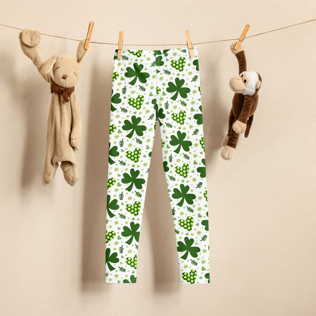 Girls buttery soft white leggings with vibrant green shamrock and heart pattern perfect for festive wear