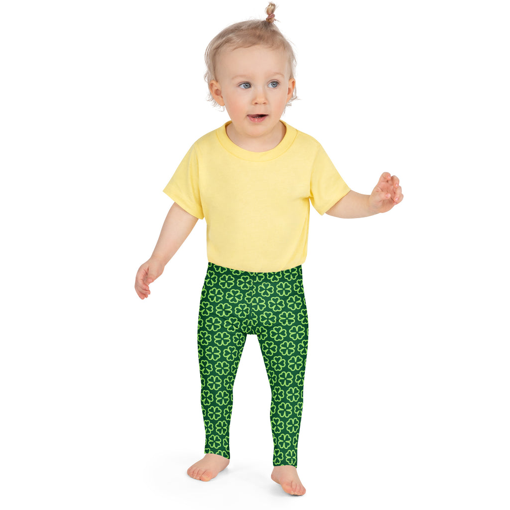 Girls dark green buttery soft leggings with a repeating white four leaf clover shamrock pattern