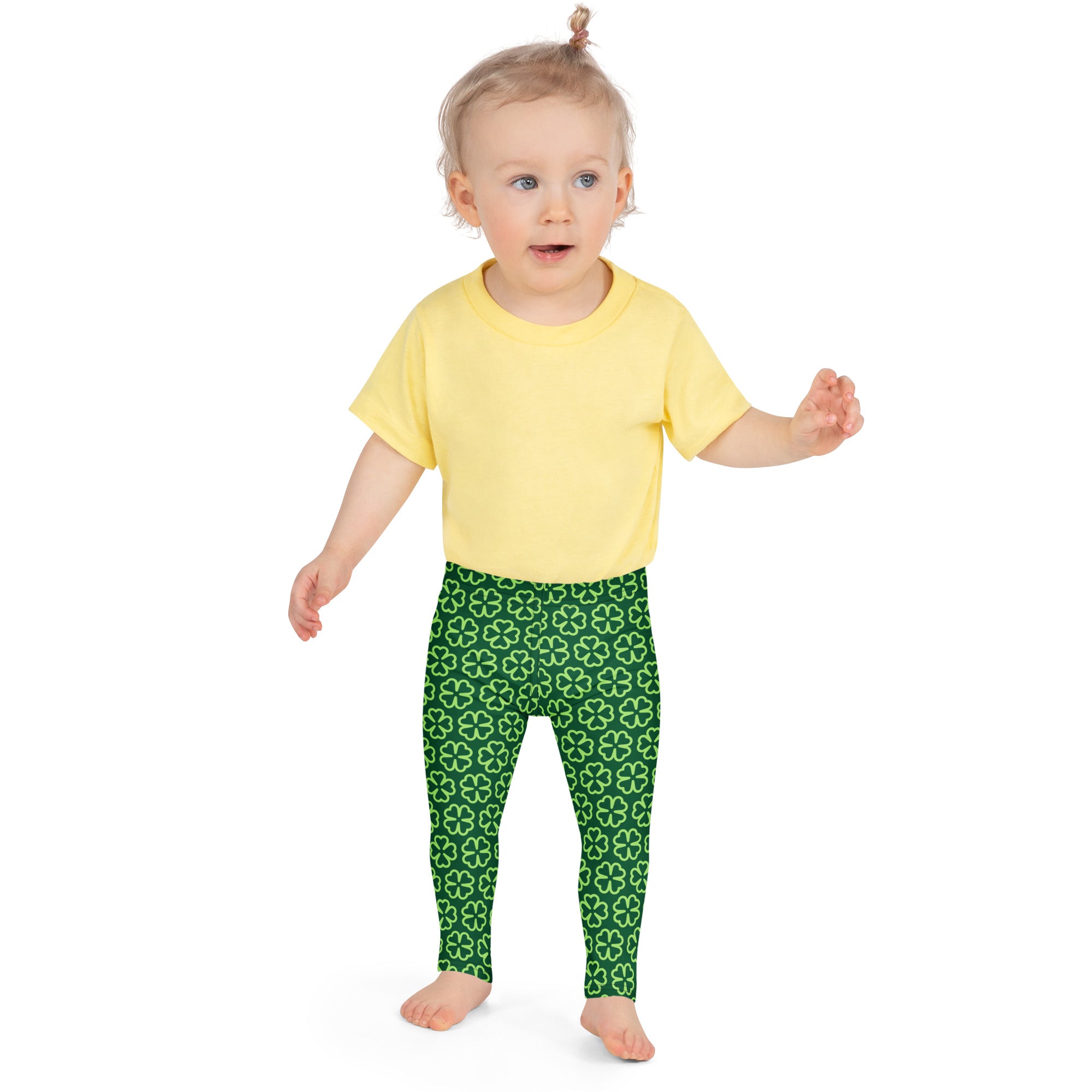 Girls dark green buttery soft leggings with a repeating white four leaf clover shamrock pattern
