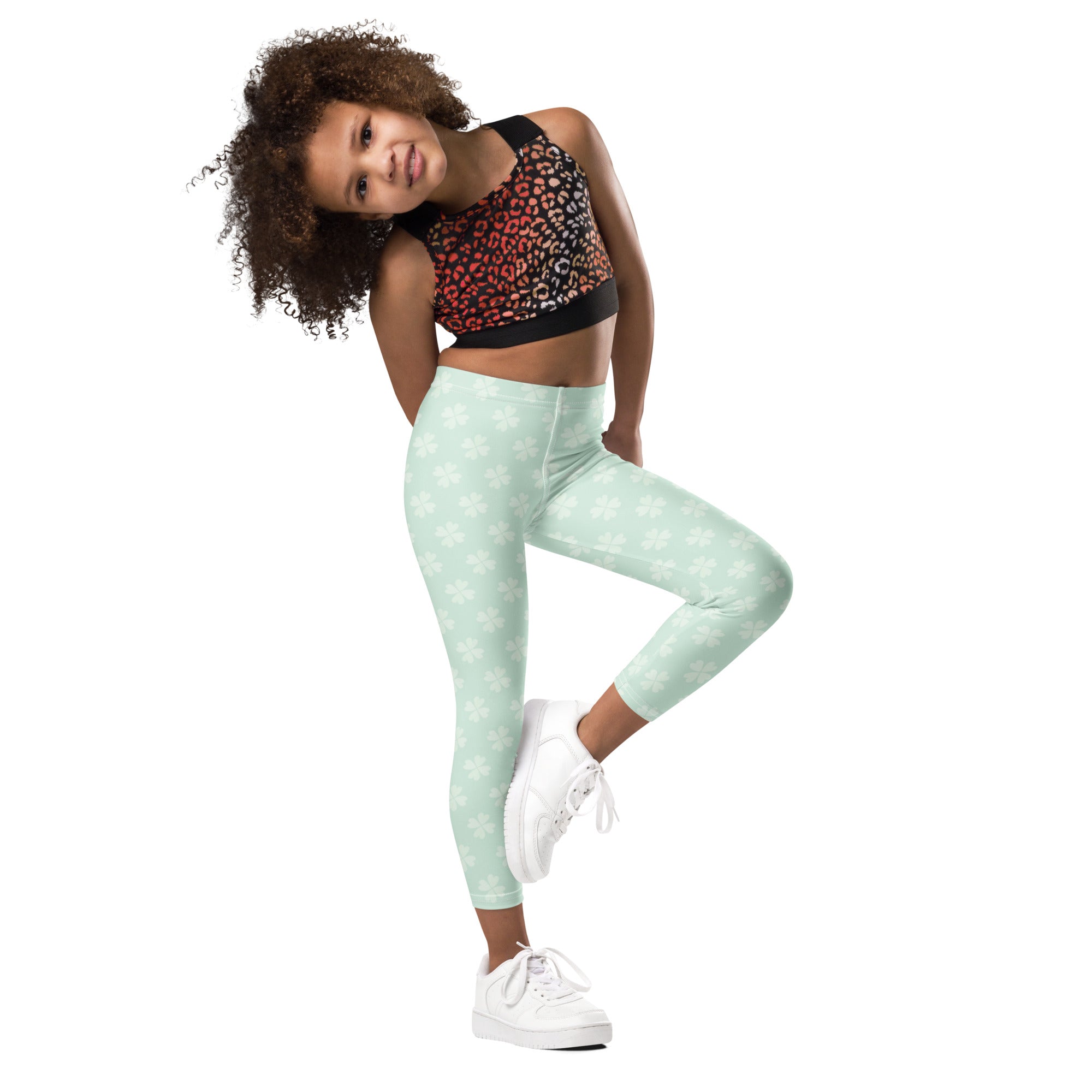 Girls mint shamrock buttery soft leggings in mint green with a subtle white paw print pattern
