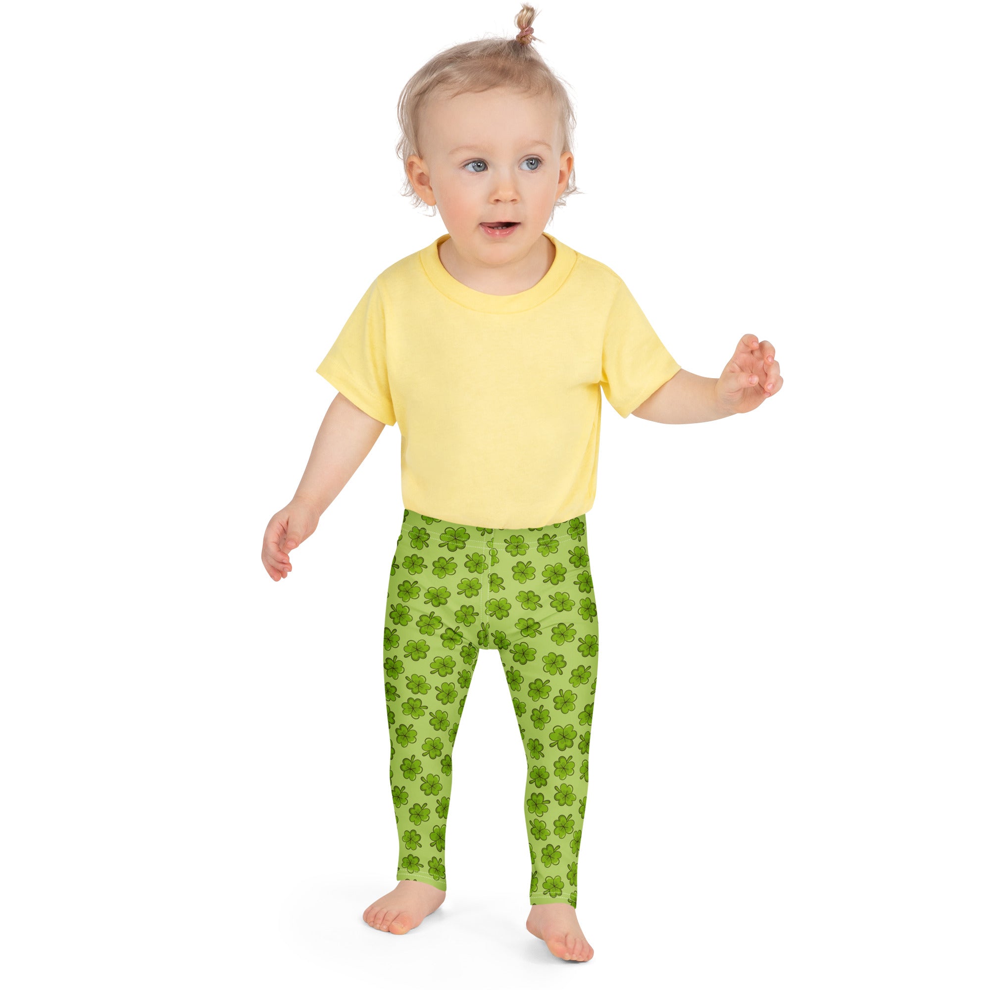 Girls lime green buttery soft leggings with a bright shamrock pattern perfect for festive wear