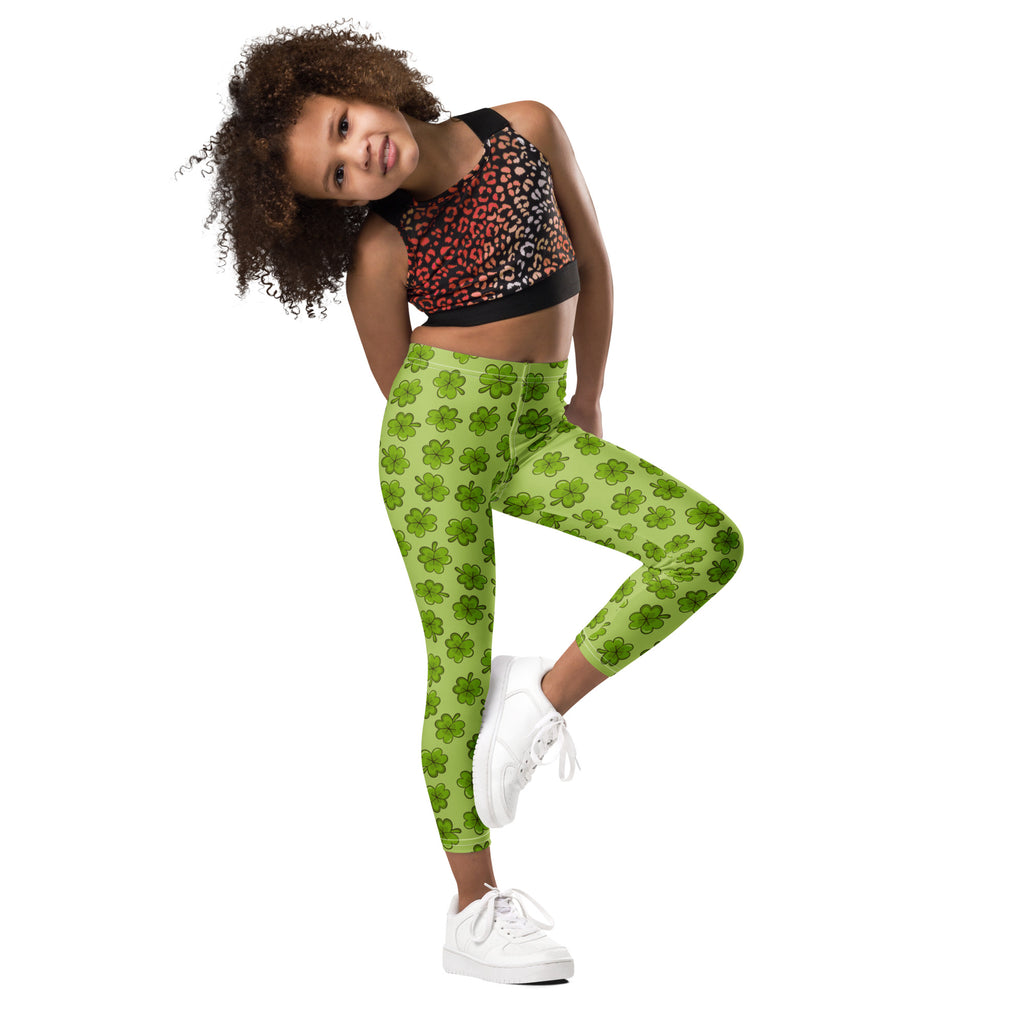 Girls lime green buttery soft leggings with a bright shamrock pattern perfect for festive wear
