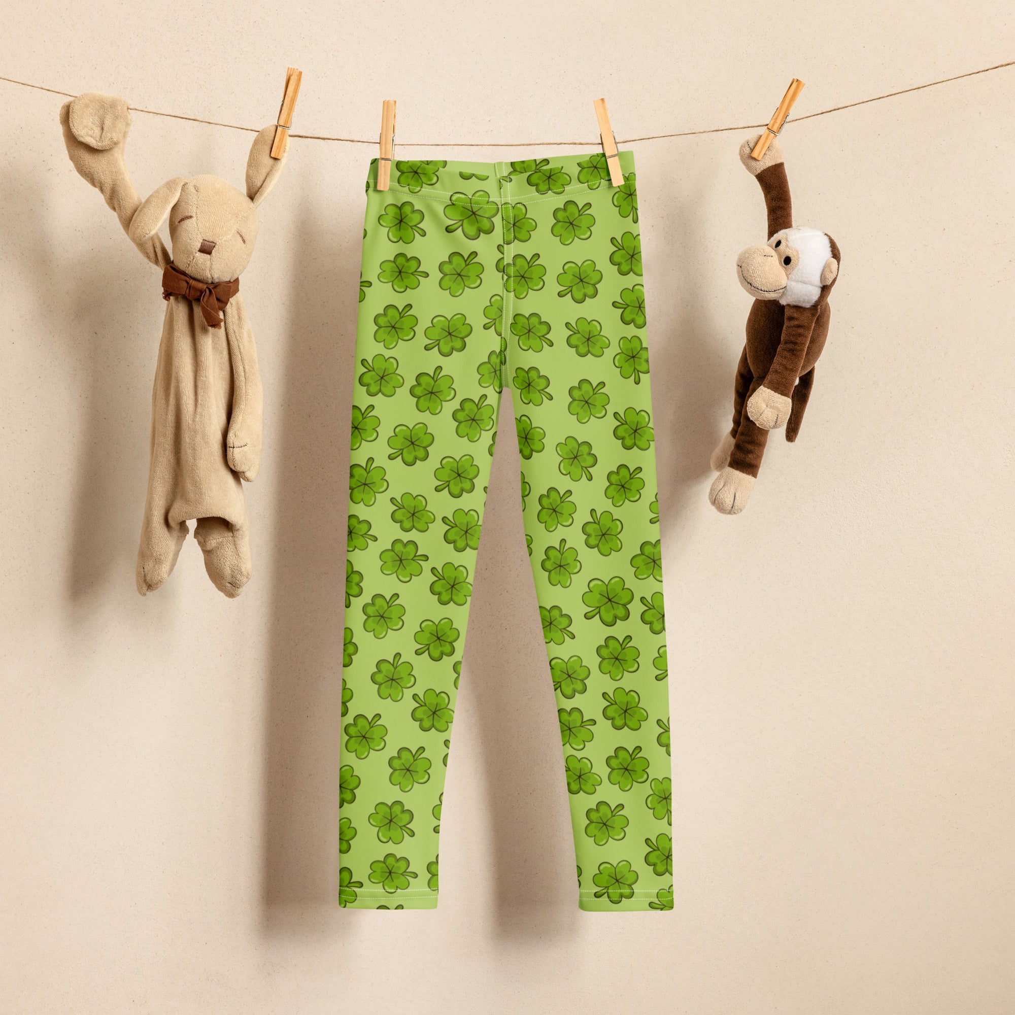 Girls lime green buttery soft leggings with a bright shamrock pattern perfect for festive wear