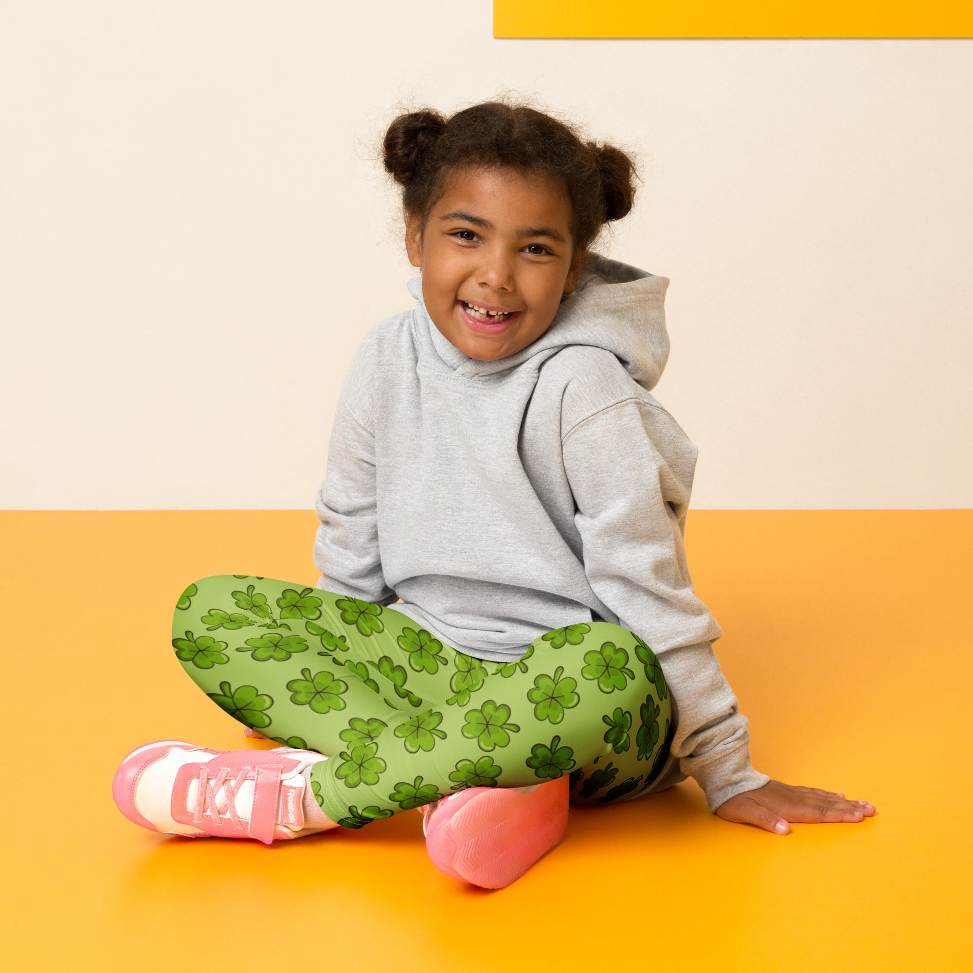 Girls lime green shamrock buttery soft leggings featuring a stretchy pattern perfect for comfortable wear