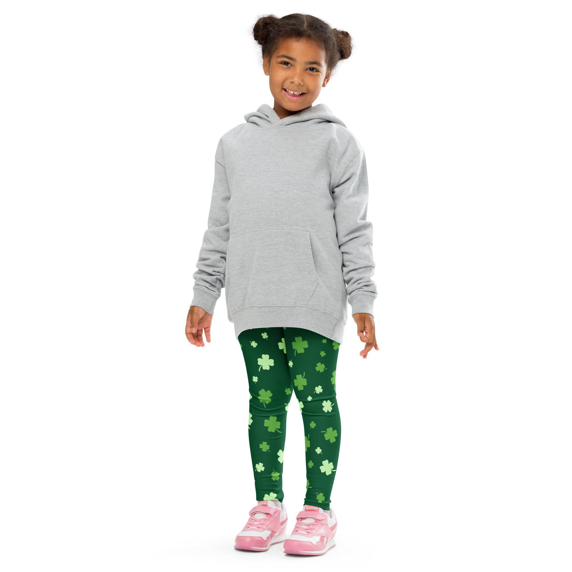 Girl wearing gray hooded sweatshirt with front pocket and long sleeves paired with lucky clover buttery soft leggings