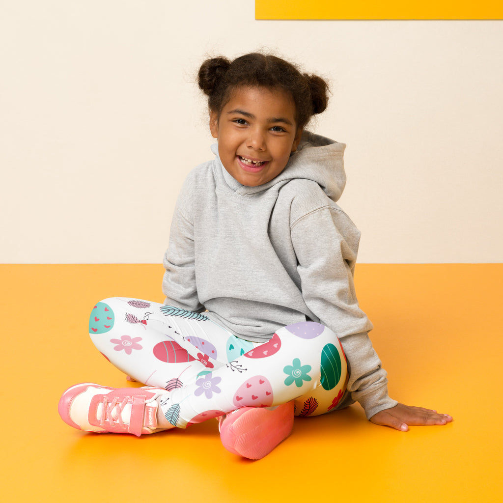 White kids floral easter egg buttery soft leggings with colorful pink green purple and teal stretchy fabric patterns